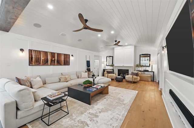 living room with recessed lighting, ceiling fan, wooden ceiling, and light wood-type flooring