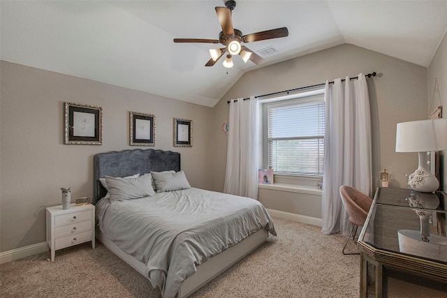 bedroom with light colored carpet, vaulted ceiling, and visible vents