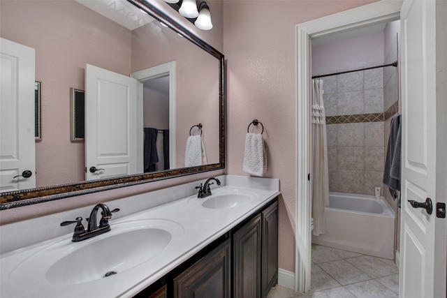 full bathroom with a sink, tile patterned floors, double vanity, and shower / tub combo