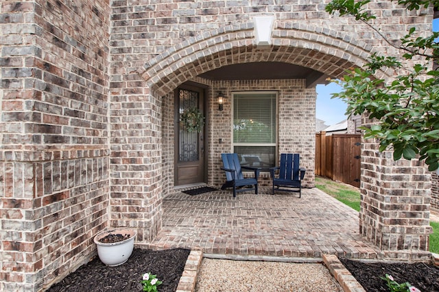 view of patio / terrace featuring fence