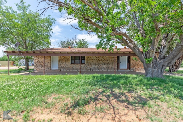 415 Sweetwater Rd, Bronte, TX 76933 - view of front of house with a front lawn and stone siding