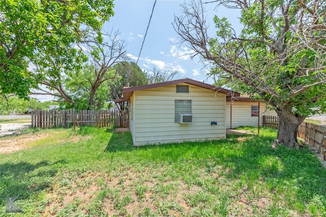 415 Sweetwater Rd, Bronte, TX 76933 - back of property featuring a yard, fence, and cooling unit