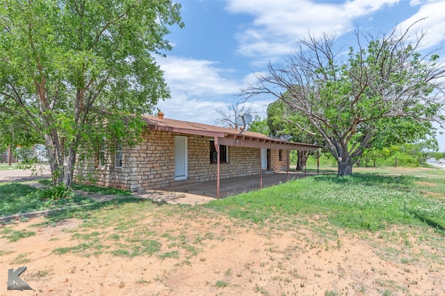415 Sweetwater Rd, Bronte, TX 76933 - exterior space with a patio area and stone siding