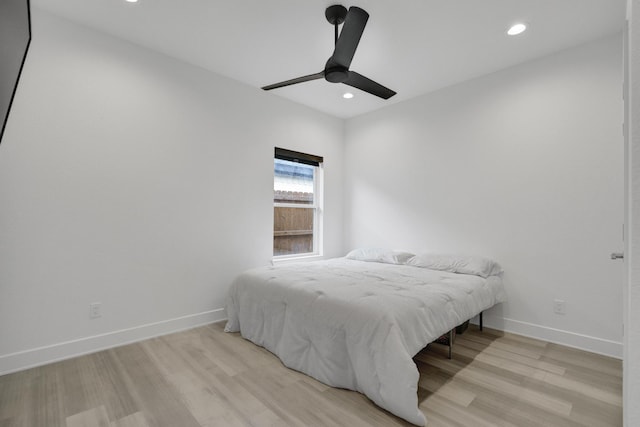 bedroom featuring recessed lighting, baseboards, ceiling fan, and light wood finished floors