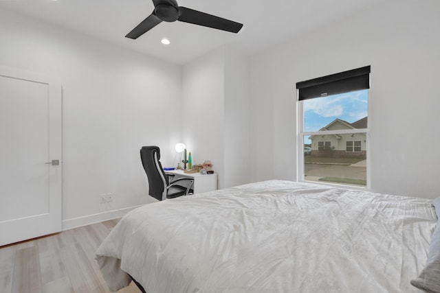 bedroom featuring recessed lighting, a ceiling fan, baseboards, and wood finished floors
