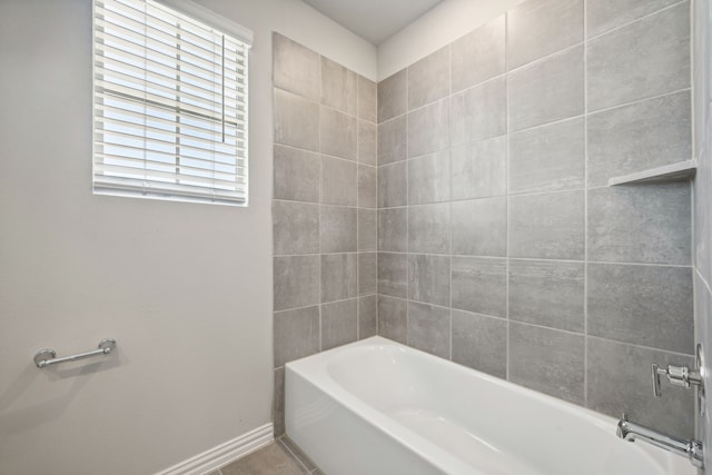 bathroom featuring baseboards and tile patterned floors