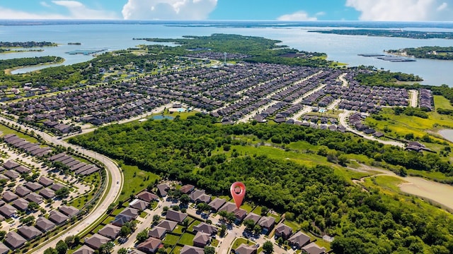 bird's eye view featuring a residential view and a water view