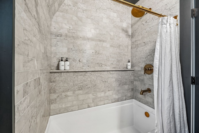 bathroom with shower / tub combo