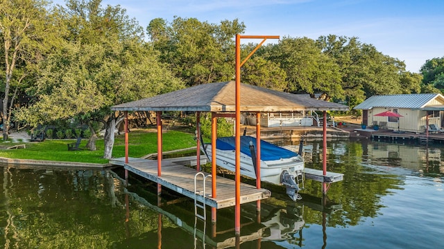 dock area featuring boat lift and a water view