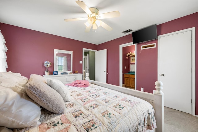 carpeted bedroom featuring a ceiling fan and visible vents