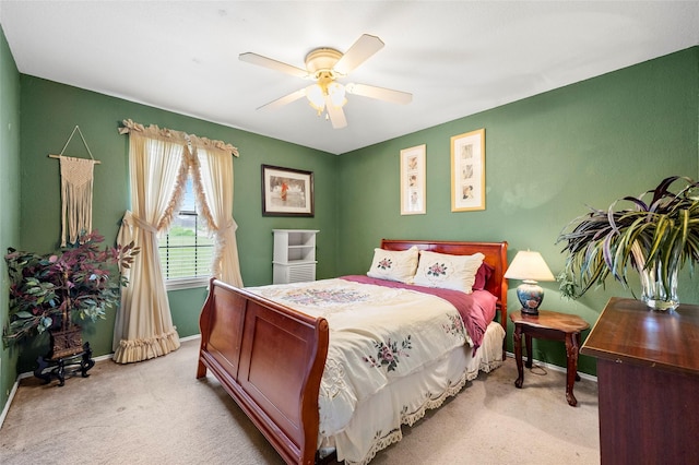 bedroom featuring carpet floors, a ceiling fan, and baseboards