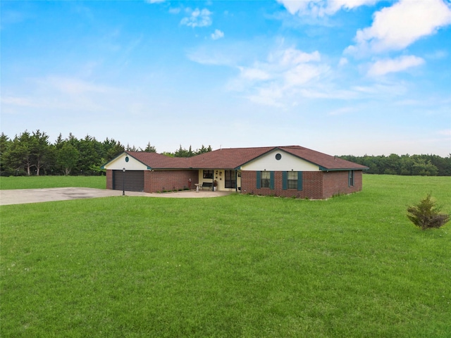 ranch-style house featuring concrete driveway, brick siding, and a front yard