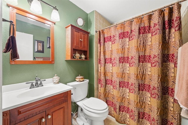 full bathroom featuring vanity, a textured wall, a shower with curtain, and toilet