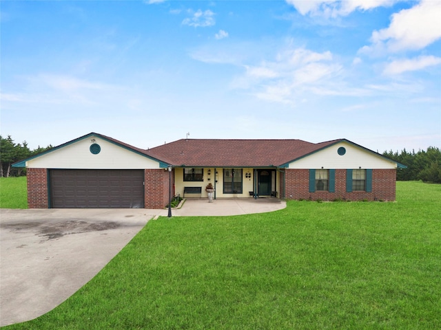 ranch-style home featuring brick siding, a garage, a front lawn, and driveway