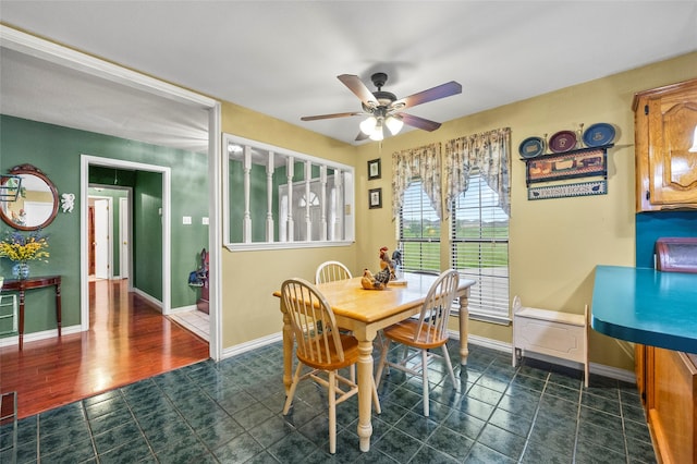 dining area featuring baseboards, a ceiling fan, and visible vents