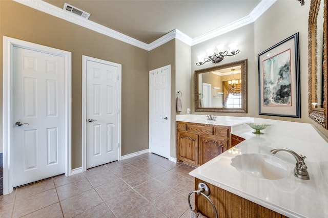 full bath featuring an inviting chandelier, ornamental molding, visible vents, vanity, and tile patterned floors