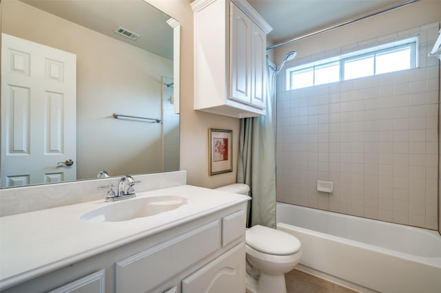 bathroom with tile patterned flooring, shower / tub combo with curtain, vanity, toilet, and visible vents