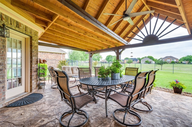 view of patio / terrace with outdoor dining area, a fenced backyard, and ceiling fan