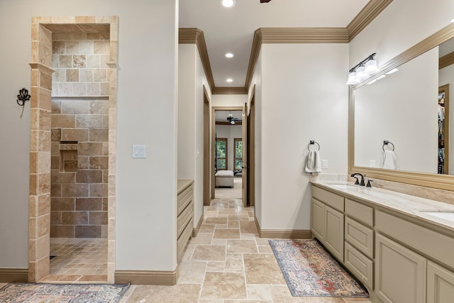 11374 Texas Highway 154 S, Yantis, TX 75497 - ensuite bathroom featuring crown molding, a sink, ensuite bath, baseboards, and stone tile flooring