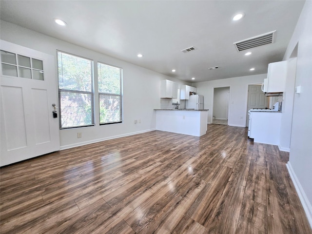 3818 Vilbig Rd, Dallas, TX 75212 - unfurnished living room with dark wood finished floors, baseboards, and recessed lighting