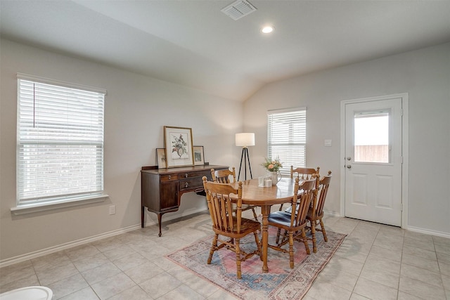 dining space featuring visible vents, vaulted ceiling, light tile patterned floors, baseboards, and recessed lighting