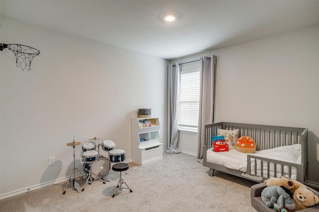 carpeted bedroom featuring baseboards