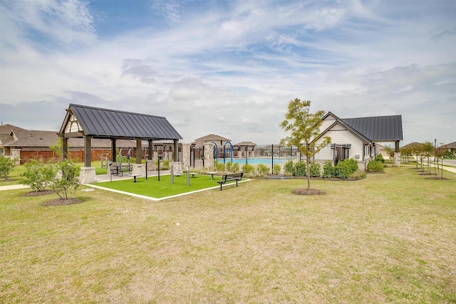 surrounding community featuring a yard, a gazebo, and fence