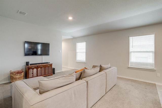 living area with baseboards, light colored carpet, recessed lighting, and visible vents