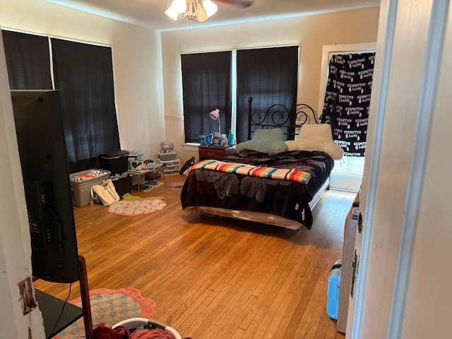 bedroom with hardwood / wood-style floors