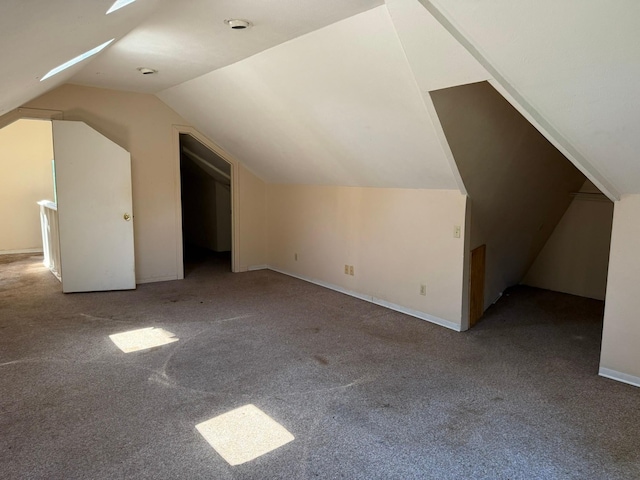 1811 8th St, Wichita Falls, TX 76301 - additional living space featuring carpet, vaulted ceiling, and baseboards