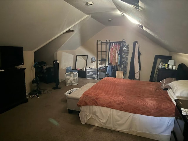 carpeted bedroom with vaulted ceiling
