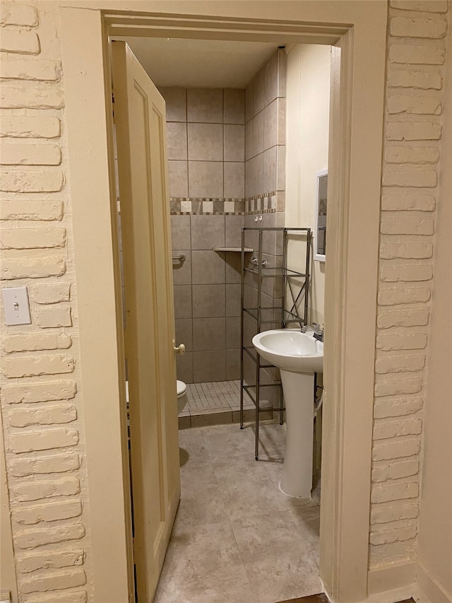 bathroom with a stall shower and toilet