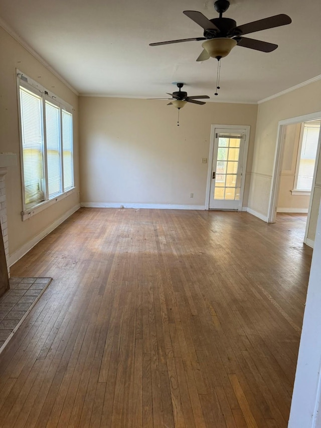1811 8th St, Wichita Falls, TX 76301 - empty room with a ceiling fan, hardwood / wood-style flooring, baseboards, and ornamental molding