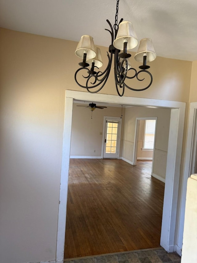 1811 8th St, Wichita Falls, TX 76301 - empty room featuring a chandelier, wood finished floors, and baseboards