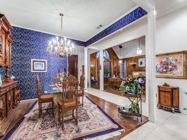 5405 Channel Isle Dr, Plano, TX 75093 - dining area with a chandelier, decorative columns, ornamental molding, a textured ceiling, and wallpapered walls