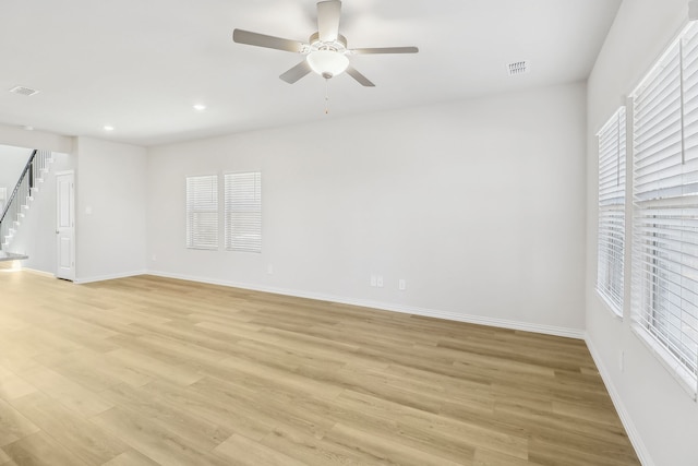 607 Willet Dr, Mckinney, TX 75069 - empty room with stairs, ceiling fan, visible vents, and light wood-style flooring