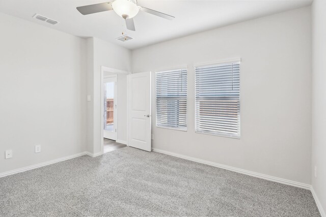 607 Willet Dr, Mckinney, TX 75069 - empty room featuring visible vents, carpet flooring, baseboards, and a ceiling fan