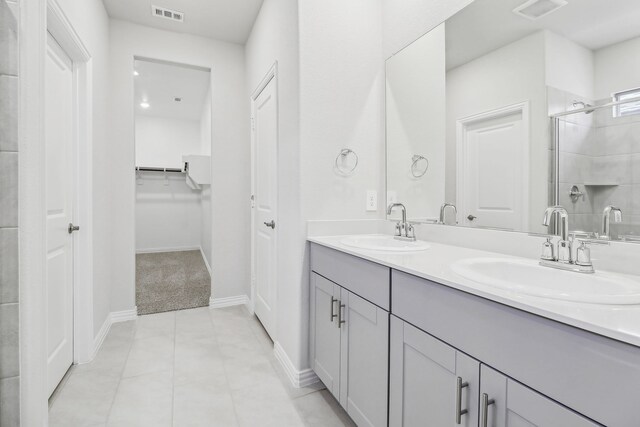 607 Willet Dr, Mckinney, TX 75069 - full bathroom with a sink, a tile shower, double vanity, and visible vents