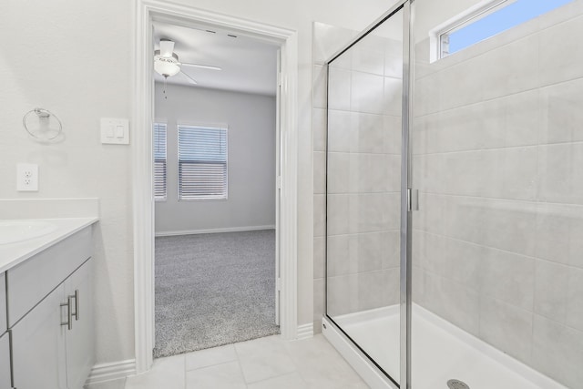 607 Willet Dr, Mckinney, TX 75069 - bathroom featuring tile patterned flooring, vanity, a ceiling fan, baseboards, and a stall shower