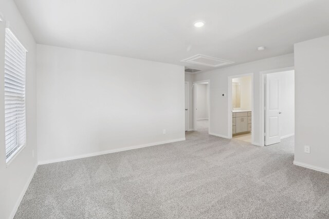 607 Willet Dr, Mckinney, TX 75069 - unfurnished bedroom with multiple windows, baseboards, light carpet, and attic access
