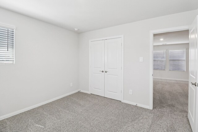 607 Willet Dr, Mckinney, TX 75069 - unfurnished bedroom with baseboards, carpet, and a closet