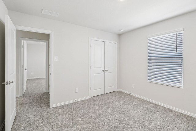 607 Willet Dr, Mckinney, TX 75069 - unfurnished bedroom with baseboards, visible vents, carpet, and a closet
