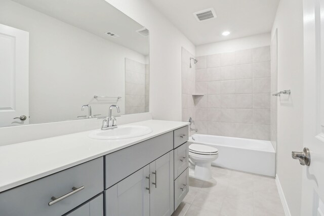 607 Willet Dr, Mckinney, TX 75069 - bathroom featuring visible vents, vanity, tile patterned floors, toilet, and washtub / shower combination