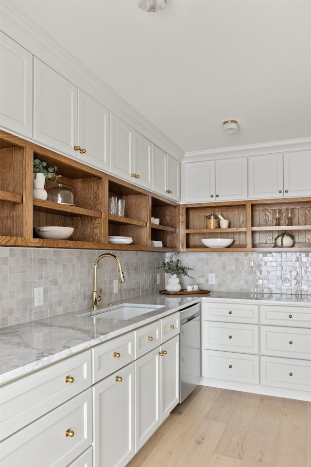 kitchen featuring a sink, stainless steel dishwasher, open shelves, and tasteful backsplash
