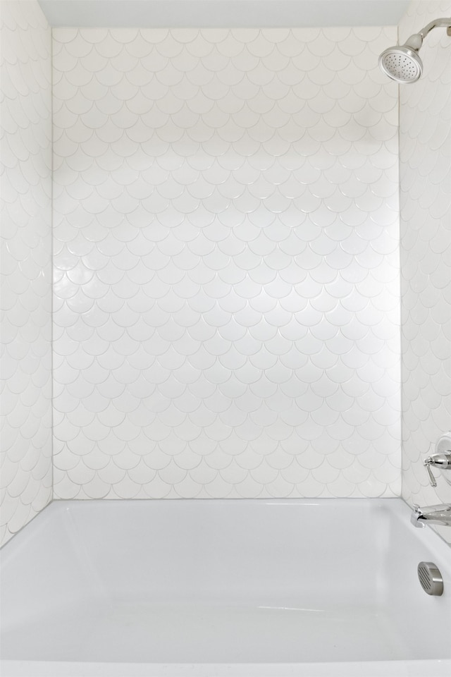full bathroom with a tub and walk in shower
