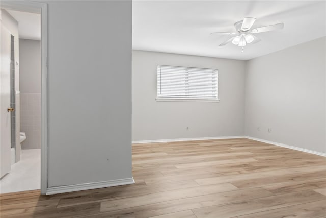 6007 Sandhurst Ln Unit B, Dallas, TX 75206 - empty room with light wood-style floors, baseboards, and ceiling fan