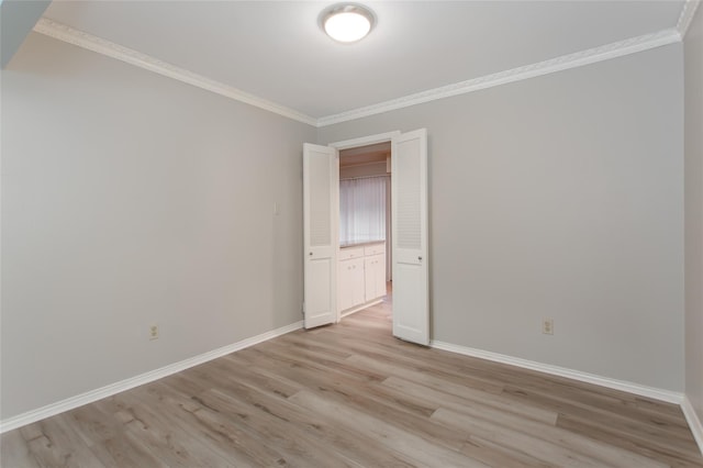 6007 Sandhurst Ln Unit B, Dallas, TX 75206 - unfurnished room with baseboards, ornamental molding, and light wood-style flooring