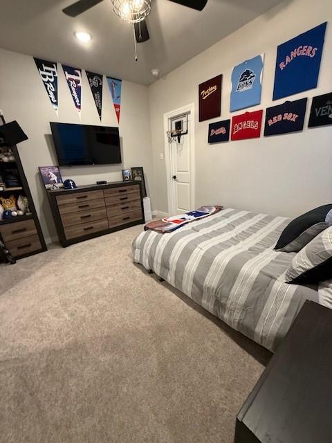 carpeted bedroom featuring ceiling fan