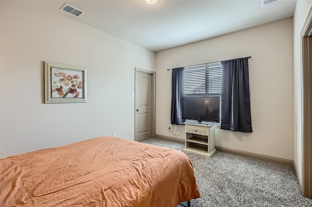 bedroom featuring visible vents, carpet flooring, and baseboards