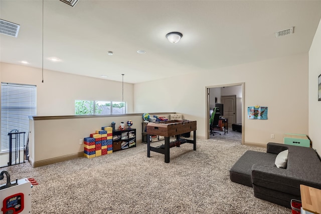 game room with visible vents, carpet, and baseboards